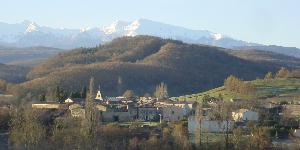 The village of Limbrassac with the Pyrenees in the background